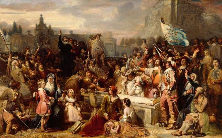 A large painting of people signing a large document surrounded by crowds including a preacher.